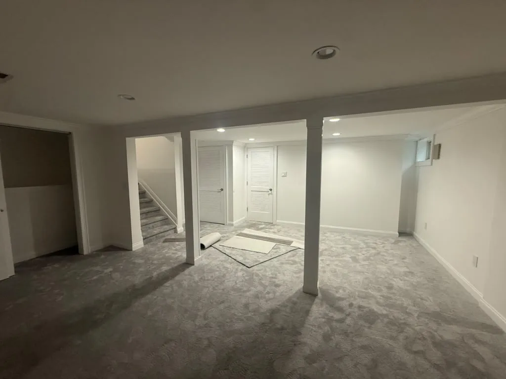 Finished basement with carpet, drywall and recessed lighting