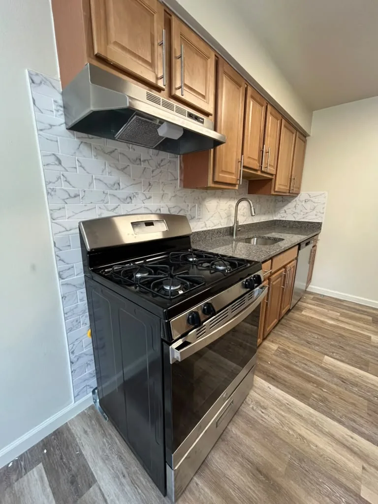 Kitchen with wood cabinets and granite counters