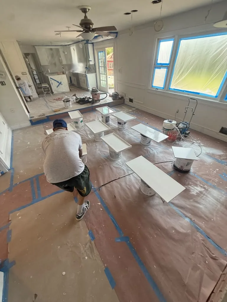 Crew working on site with floors fully protected